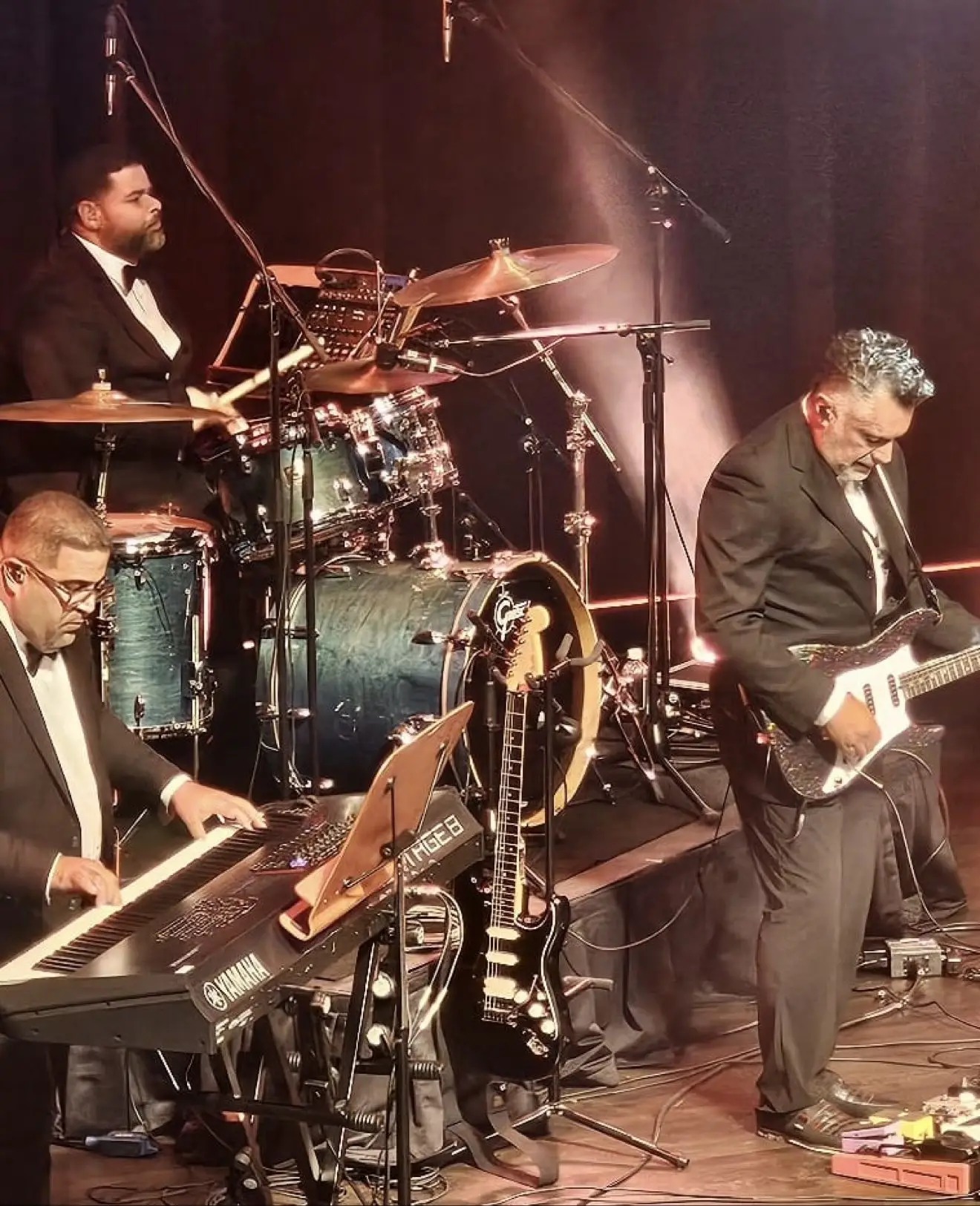 Emanuel Lozada in a suit backstage at a theater performance